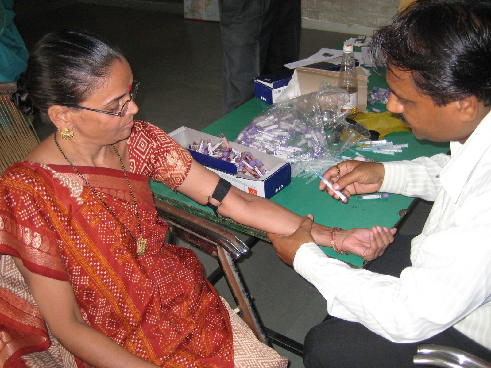 A woman receives a health check-up at a Gramshree medical camp
